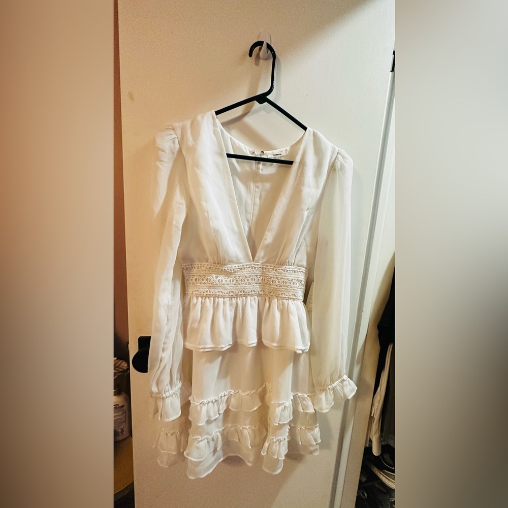 Like new . Never been worn Tularosa dress